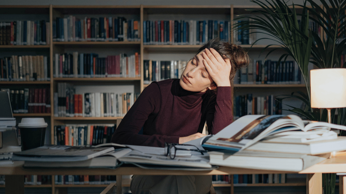 a woman clearly frustrated while studying